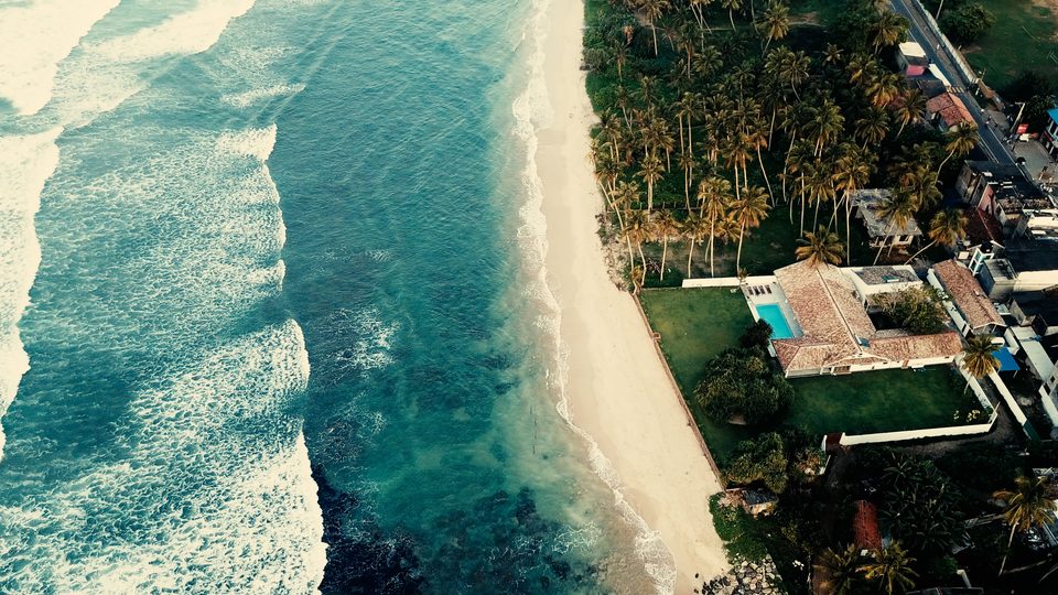 Aerial view of the reef and waves in front of the villa