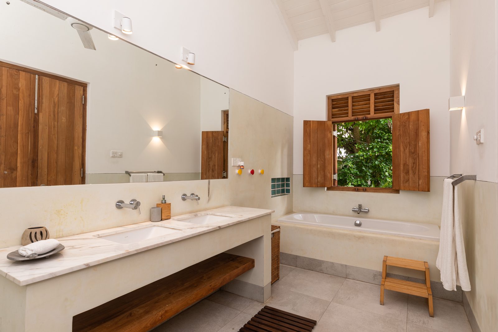 The kids' ensuite with double basins and a large bath