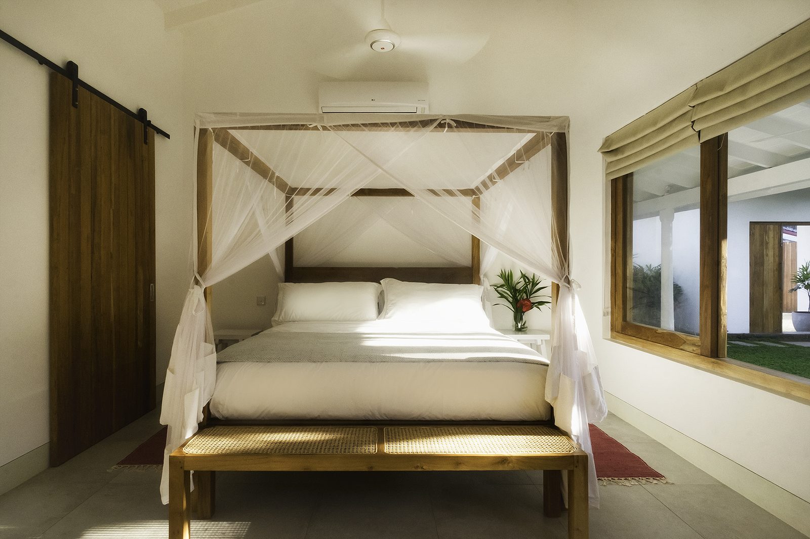 Barn door opening from a bedroom to the private courtyard